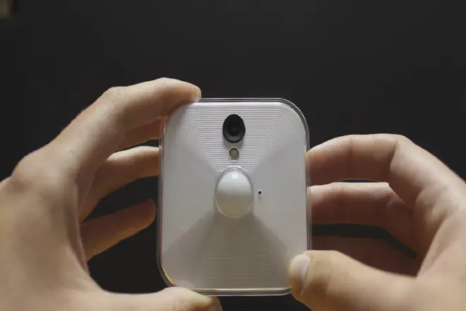 A step-by-step guide on how to change battery in blink camera, showing the battery compartment and the tools required for the process.